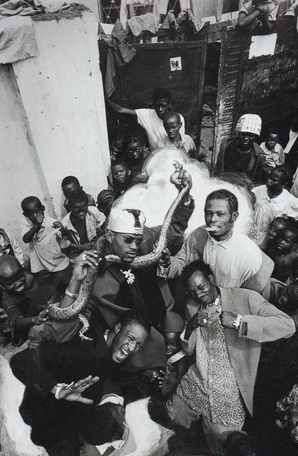 Group photo of TRYONIX, Bebson’s first music band with a python in Kinshasa, 2000. Image: Unknown.